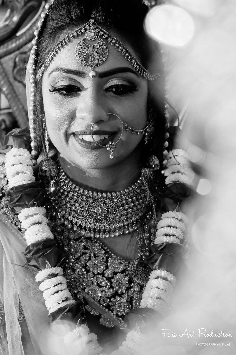 Indian bride in a traditional red bridal lehenga